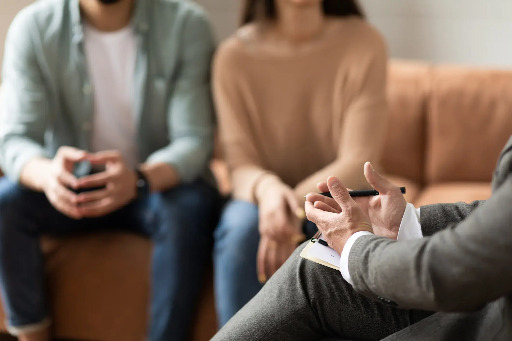 Couple talking at session with male therapist stock photo